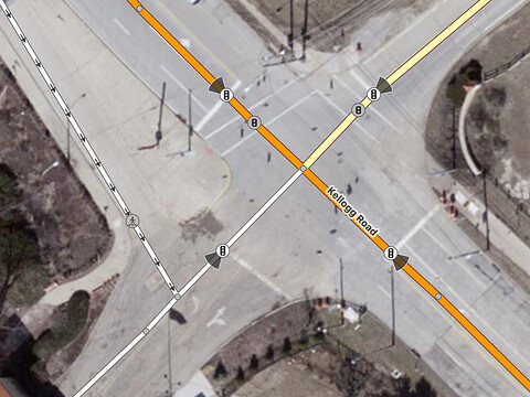 A stop line is closer to an “intersection” with a turn channel, but a directional cone indicates that it applies to the approach to Kellogg Road