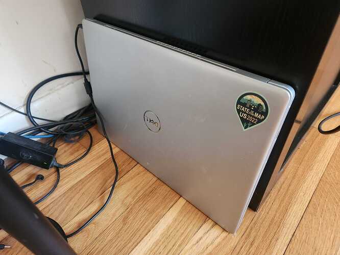 Laptop with State of the Map US sticker on it