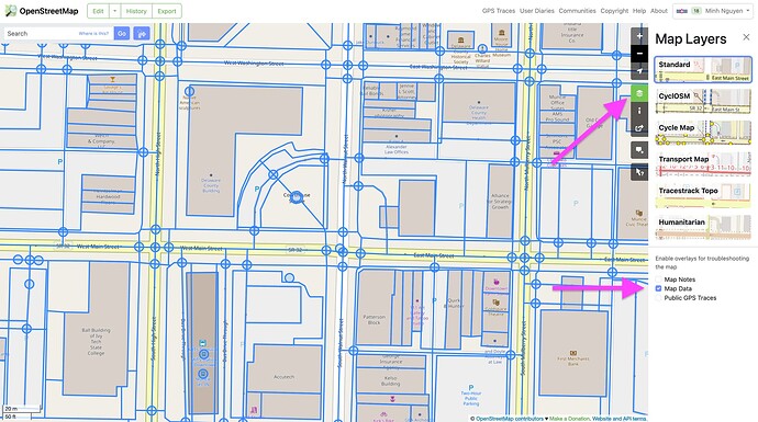 A screenshot of OpenStreetMap.org with the Map Layers sidebar open on the right. An arrow points to the button that you click to open the sidebar, and another arrow points to the Map Data checkbox in the sidebar. The checkbox is checked, so the main map has an overlay of all the raw data in the database, including streets, buildings, and sidewalks.