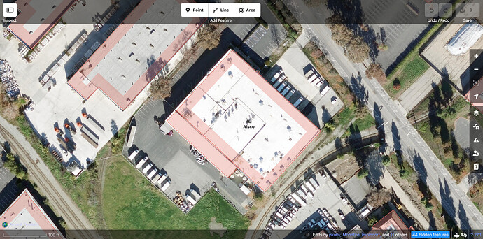 Aerial imagery centered on a large industrial building named Alsco with delivery trucks parked in front of and behind the building