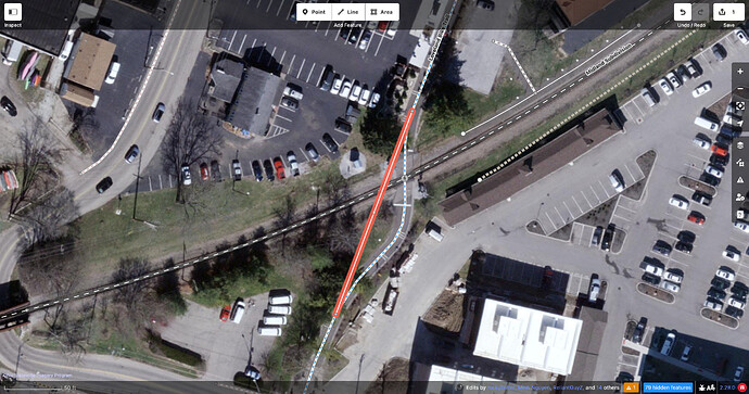 Going northbound, the Loveland Bike Trail hooks right and left in order to meet the Midland Subdivision at a right angle instead of diagonally. For demonstration, a straight way is being drawn across the junction to simulate where the old railroad tracks would have gone.