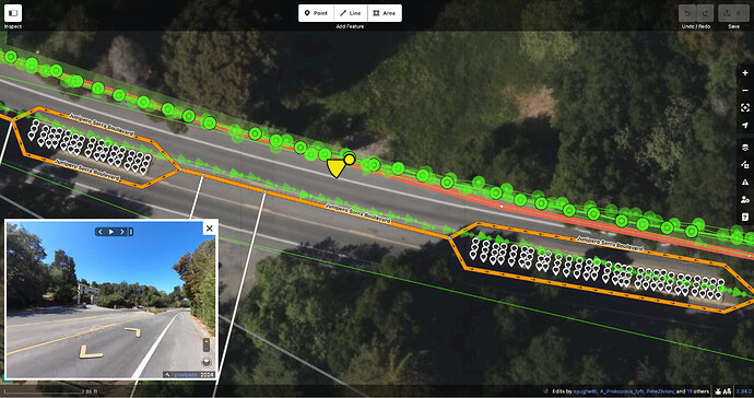 Junipero Serra Boulevard splits and rejoins around each median, interrupting a center turn lane. Inside each median are grids of shrubs and trees.