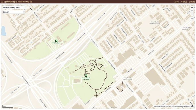 In OpenTrailMap, the paths through Emma Prusch Farm Park are depicted as thick black lines, while muted white sidewalks blend in with the residential streets they follow.
