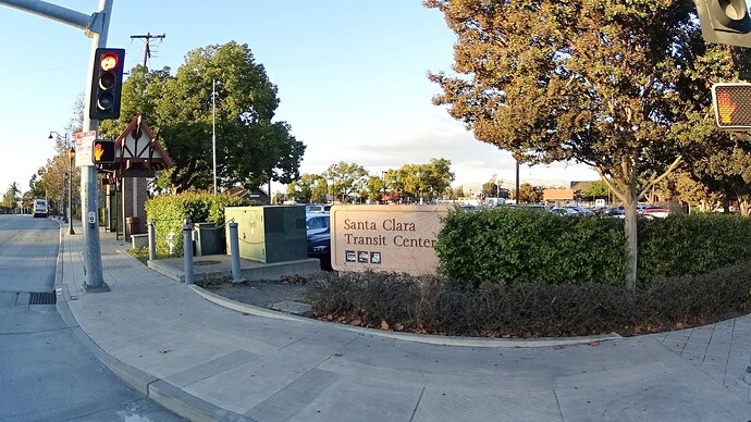 A monument sign by the sidewalk at a street corner says Santa Clara Transit Center. (© 2016 Bryan Housel, CC BY-SA 4.0)