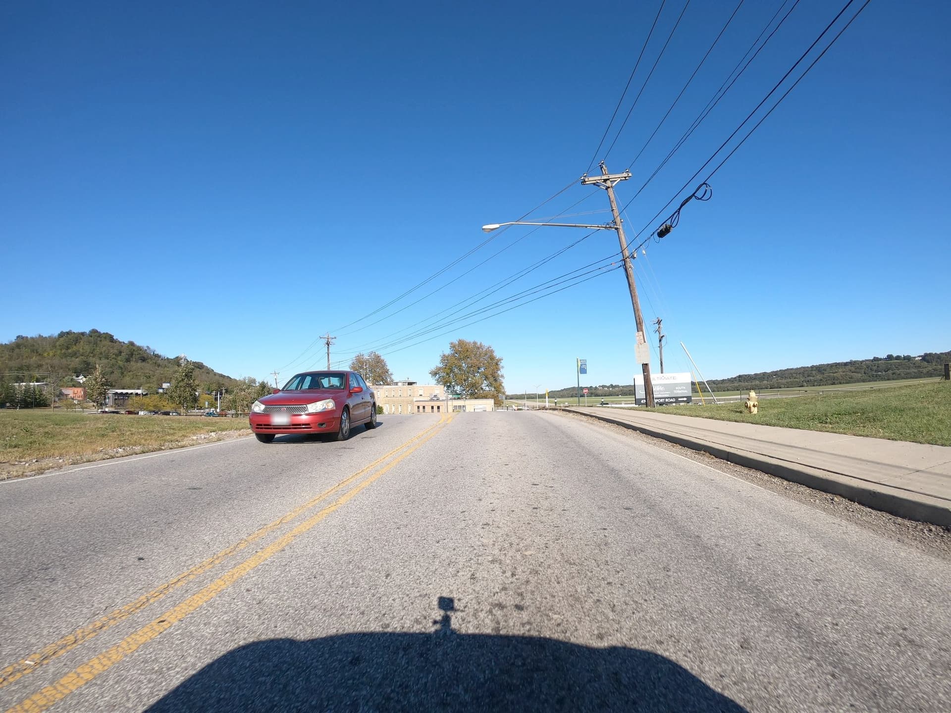 The sidewalk is separated only by a raised curb.