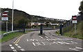 This part of the route is near the B4603 Neath Road behind the camera.
Text under the No Entry signs is "Except authorised buses" and the Welsh equivalent.